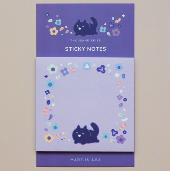 Sticky notes with cat design on a purple background