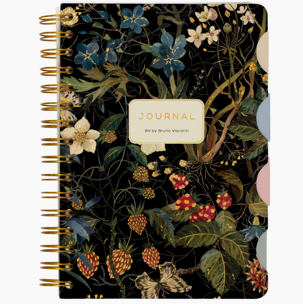 Floral-patterned notebook with a gold spiral binding on a beige background