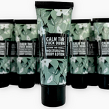 Body lotion with a green and black design on a white background