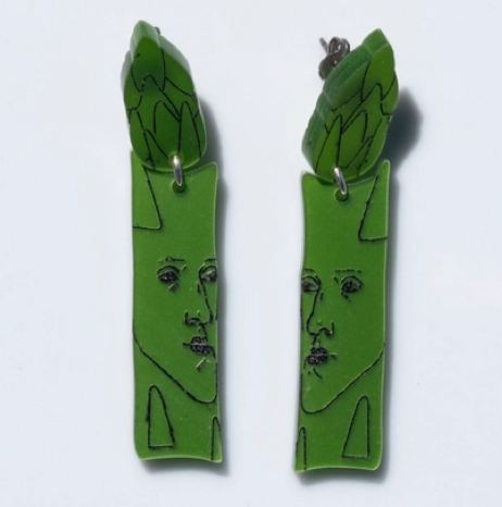Green asparagus-shaped earrings on a white background