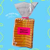 Bag of bread with 'Bread Winner' label on a blue background