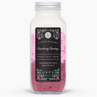 Bottle of body wash with a pink label on a white background