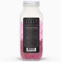 Bottle of Finch bath soap with pink scrub on a white background