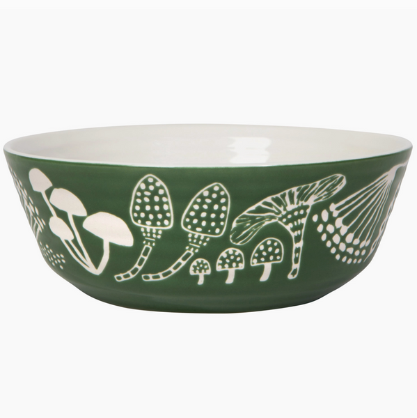 Green bowl with white mushroom pattern on a white background