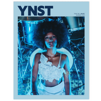 Magazine cover with a woman in a white dress and 'YNST' branding