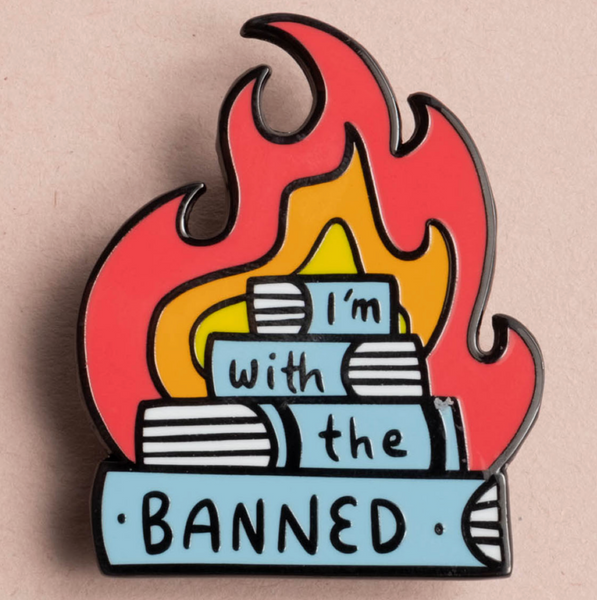 Pin with books on fire and 'I'm with the BANNED' text on a beige background