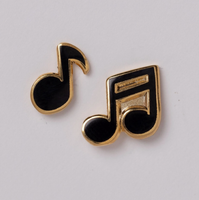 Music note earrings on a light gray background
