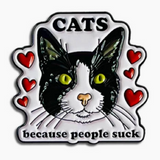 Enamel pin with a cat illustration and text on a white background