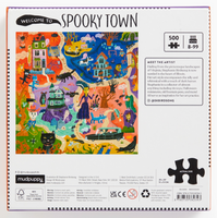 Jigsaw puzzle box for 'Spooky Town' with colorful design and text on a white background
