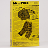LE PUZZ puzzle box with yellow and black design on a white background