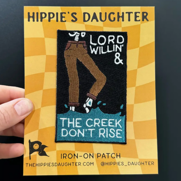 Hippie's Daughter iron-on patch with text and graphic design on a checkered background