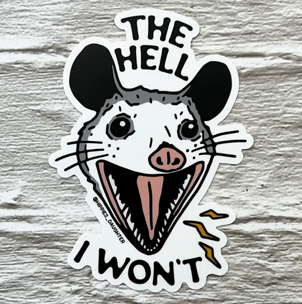 Sticker with a mouse design and text on a wooden surface
