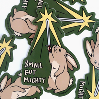Stickers with rabbits holding lightsabers and 'Small But Mighty' text on a white background