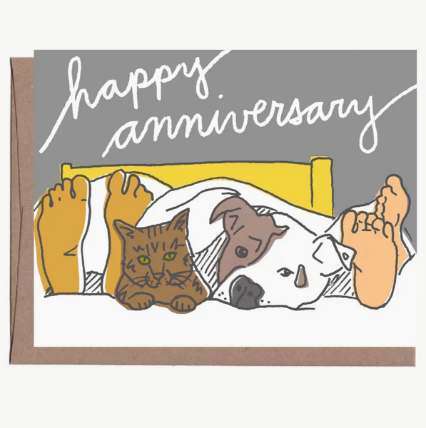 Illustration of a cat and dog lying on a bed with 'happy anniversary' text on a product page.