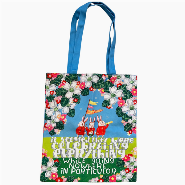 Tote bag with cartoon design and text on a white background