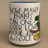 Mug with a quote about tigers and the jungle on a beige background
