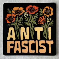 Sticker with floral design and 'A N T I FASCIST' text on a gray background