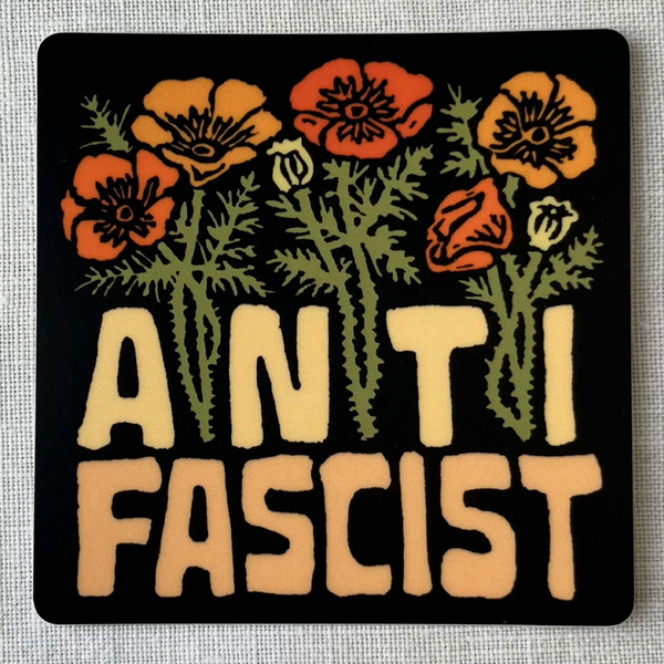 Sticker with floral design and 'A N T I FASCIST' text on a gray background