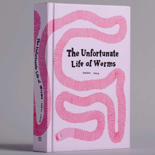Book titled 'The Unfortunate Life of Worms' with pink worm design on a gray background